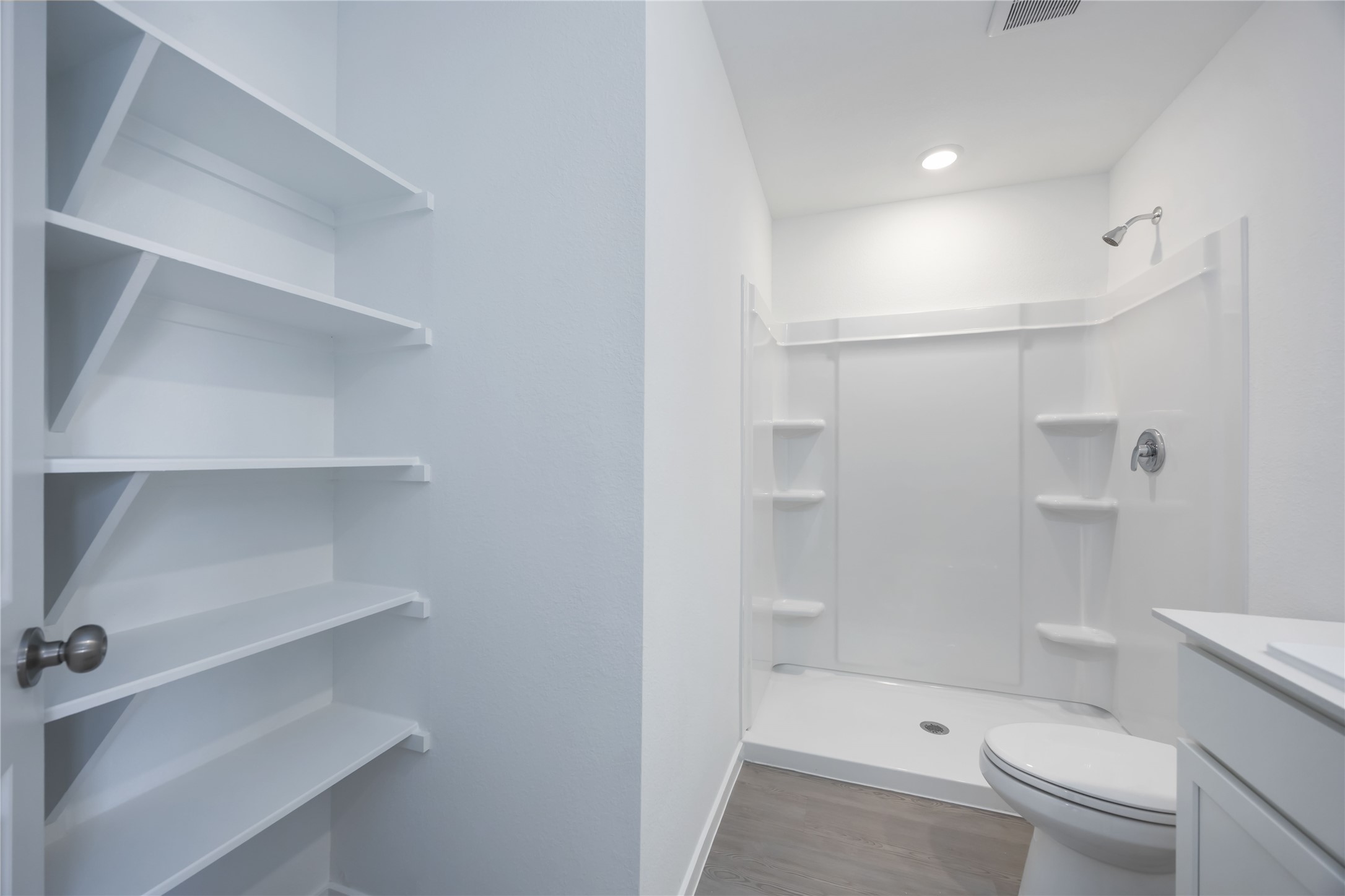 385 Lucia Way Cleveland, TX 77327 - Photo 26 of 30 a bathroom with a toilet and a shower