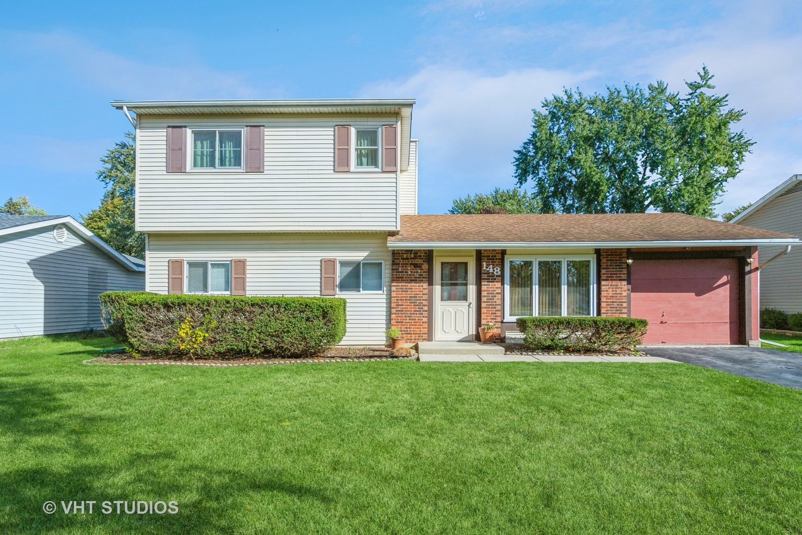 148 Springleaf Drive Bolingbrook, IL 60440 - Photo 1 of 24 a front view of a house with a yard and porch