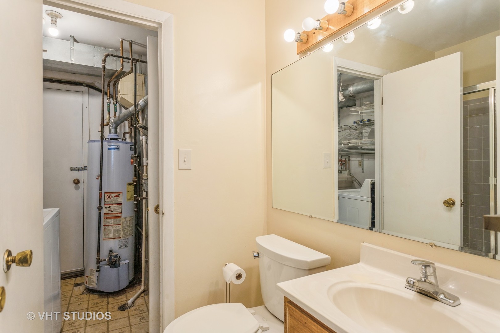 148 Springleaf Drive Bolingbrook, IL 60440 - Photo 14 of 24 a bathroom with a toilet a sink and shower