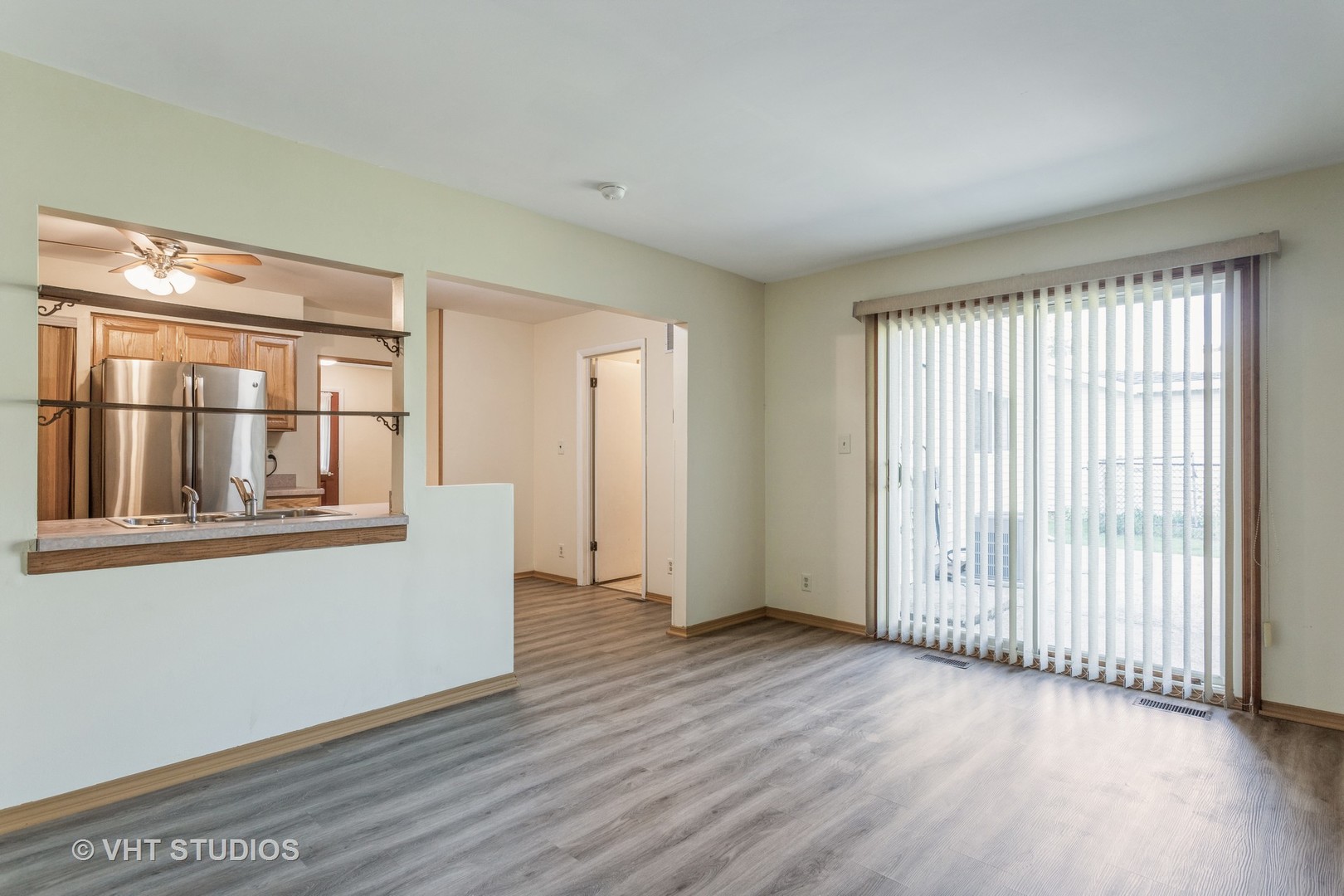 148 Springleaf Drive Bolingbrook, IL 60440 - Photo 8 of 24 a view of an empty room with wooden floor and a window