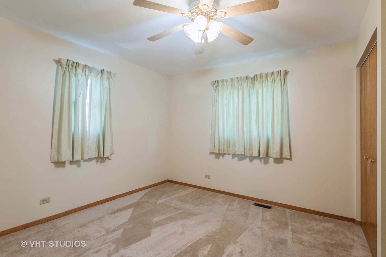 148 Springleaf Drive Bolingbrook, IL 60440 - Photo 9 of 24 an empty room with windows and fan