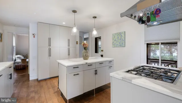 a view of a porch with furniture and backyard