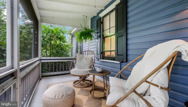 a work room with furniture and a window