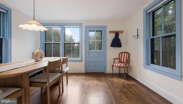 a bedroom with a bed and a white wall