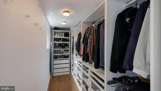 a bathroom with a granite countertop sink mirror and toilet