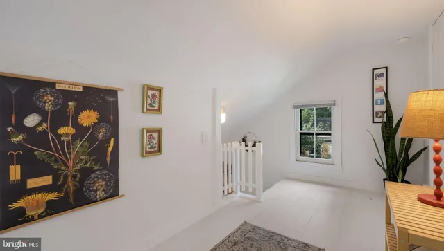 a bed room with a bed and a large window