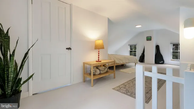 a bedroom with a bed and a mirror