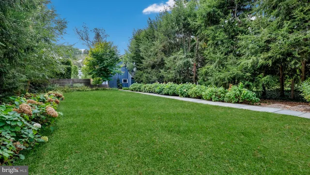 a backyard of a house with lots of green space