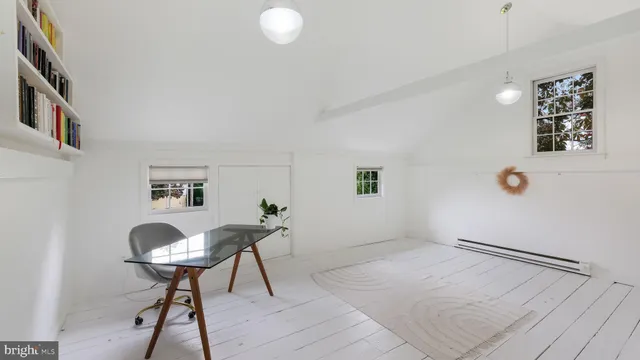 a view of a house with pool and garden