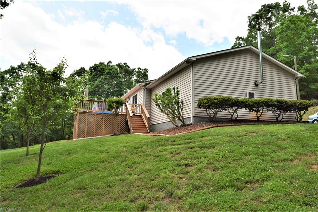 114 Rink Road Mayodan, NC 27027 - Photo 2 of 30 House perched on hillside with beautiful scenery. Huge deck. Extensive Landscaping