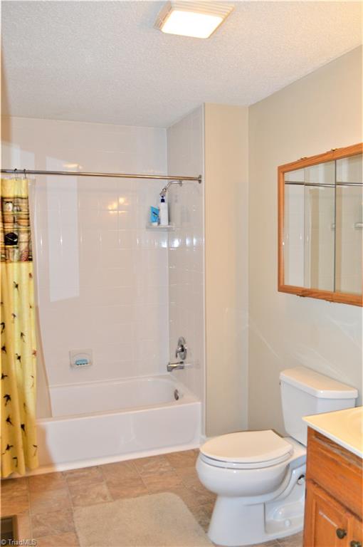 114 Rink Road Mayodan, NC 27027 - Photo 13 of 30 Master Bath: Single Sink, new tub/shower, medicine cabinet and new vinyl flooring