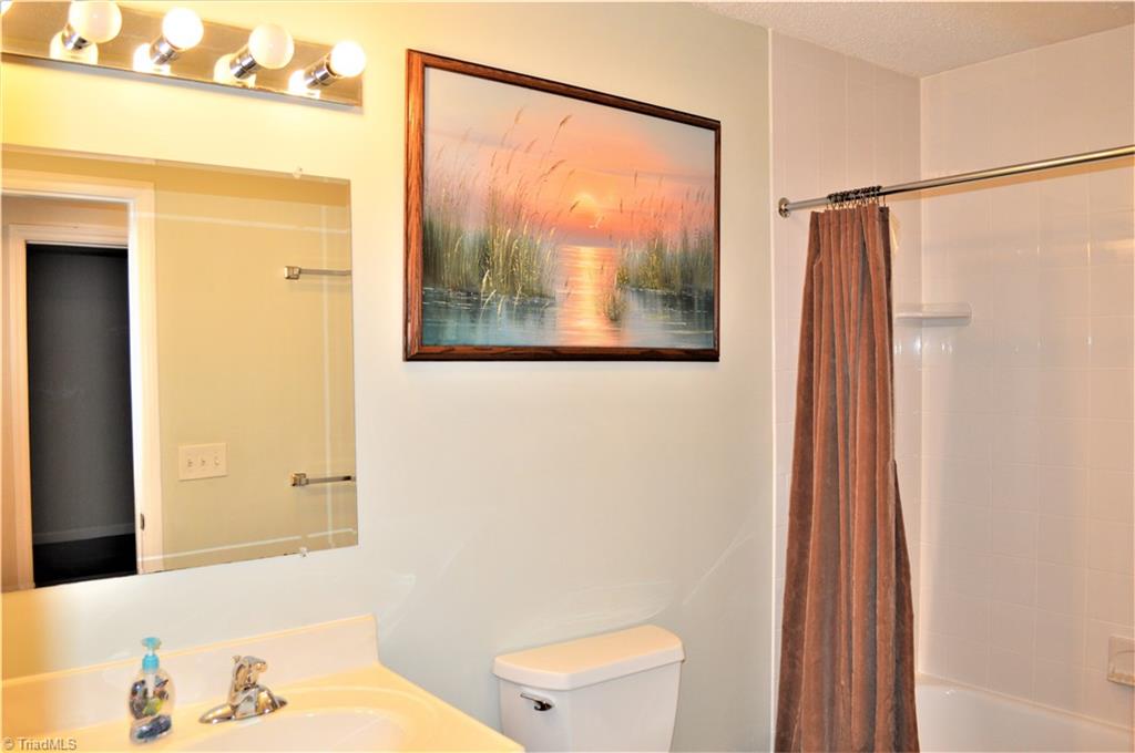 114 Rink Road Mayodan, NC 27027 - Photo 17 of 30 2nd Full Bath: New tub/shower, vinyl floor, single sink.