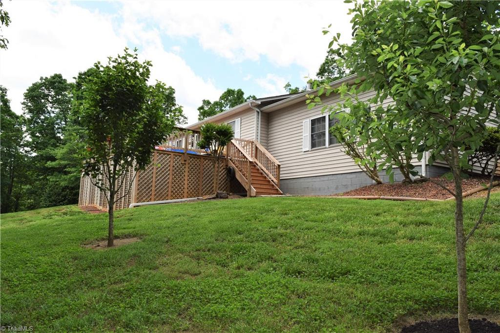 114 Rink Road Mayodan, NC 27027 - Photo 20 of 30 House perched on hillside with beautiful scenery. Huge deck. Extensive Landscaping