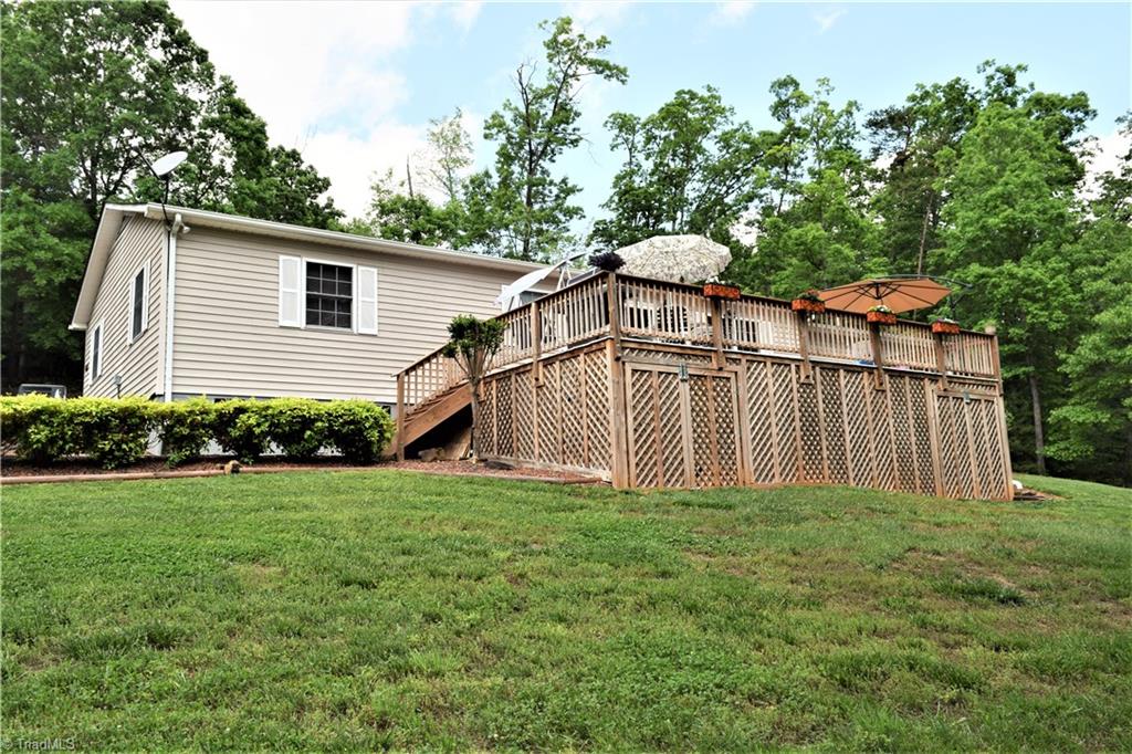 114 Rink Road Mayodan, NC 27027 - Photo 26 of 30 Extremely well maintained, Unbelievable Deck Overlooking Extensively Landscaped Yard. Deck has Excellent Storage Underneath (gravel covered ground)