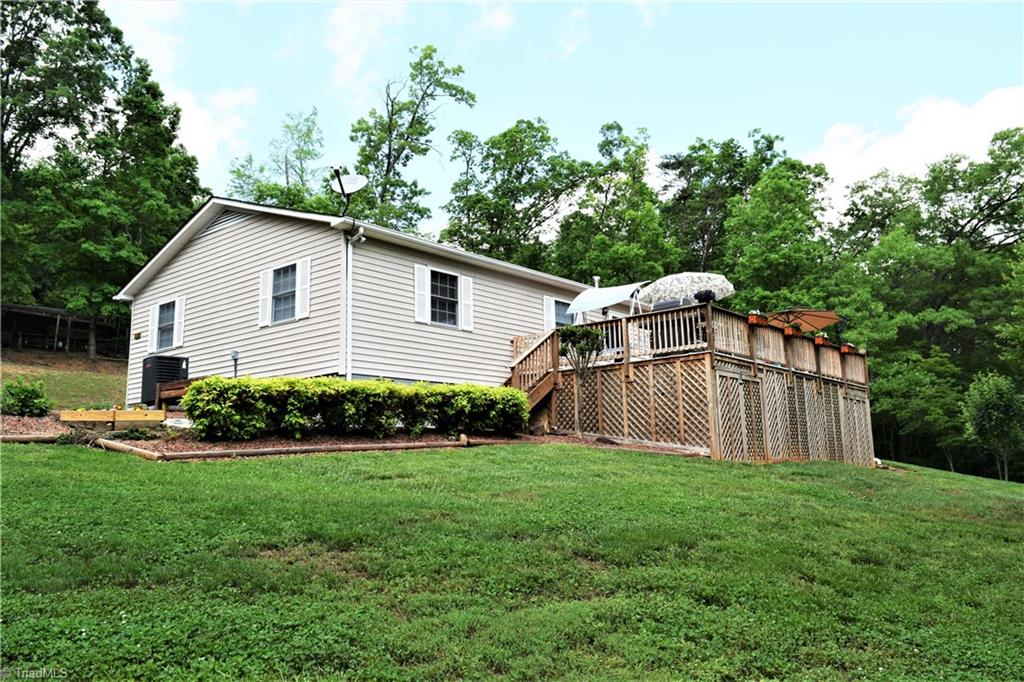 114 Rink Road Mayodan, NC 27027 - Photo 27 of 30 Extremely well maintained, Unbelievable Deck Overlooking Extensively Landscaped Yard. Deck has Excellent Storage Underneath (gravel covered ground)