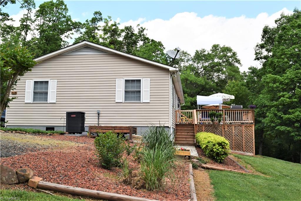 114 Rink Road Mayodan, NC 27027 - Photo 28 of 30 Extremely well maintained, Unbelievable Deck Overlooking Extensively Landscaped Yard. Deck has Excellent Storage Underneath (gravel covered ground)