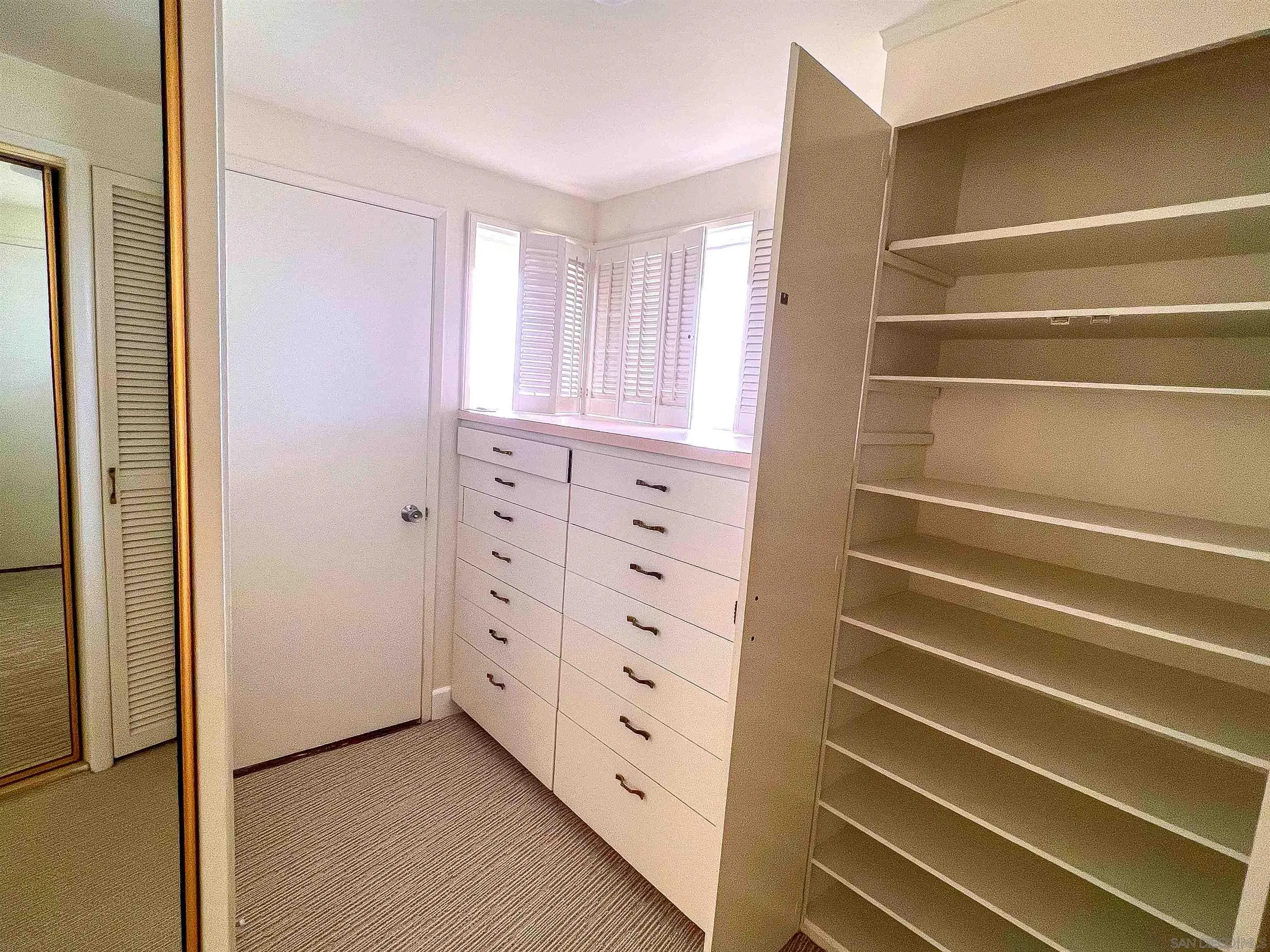 1671 Paseo Bonita La Jolla, CA 92037 - Photo 17 of 17 a view of walk in closet with empty racks