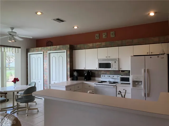 a kitchen with counter top space cabinets and stainless steel appliances