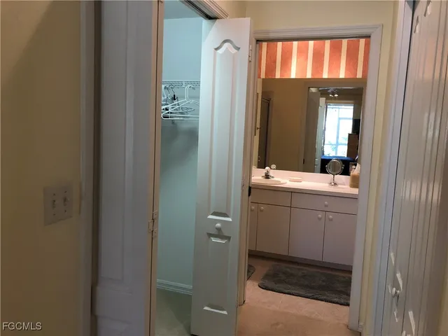 a bathroom with a sink a mirror and a shower