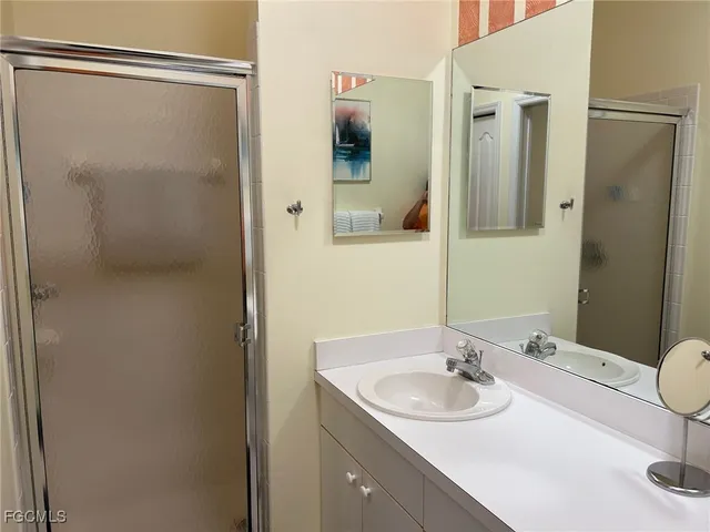 a bathroom with a sink and mirror