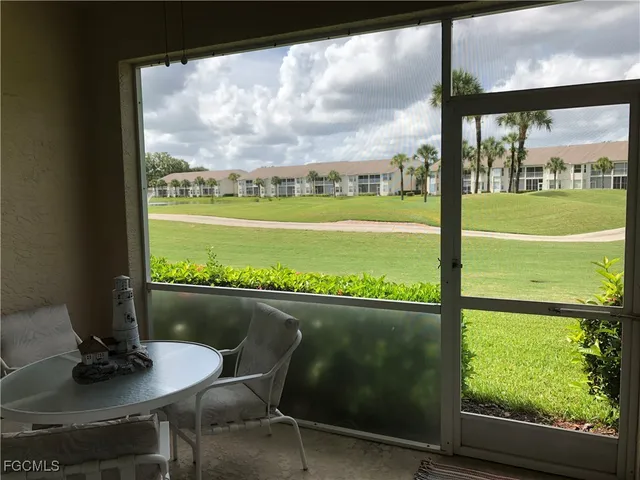 a view of a city from a dining room with large windows