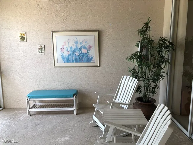 a view of sitting area with furniture and wooden floor