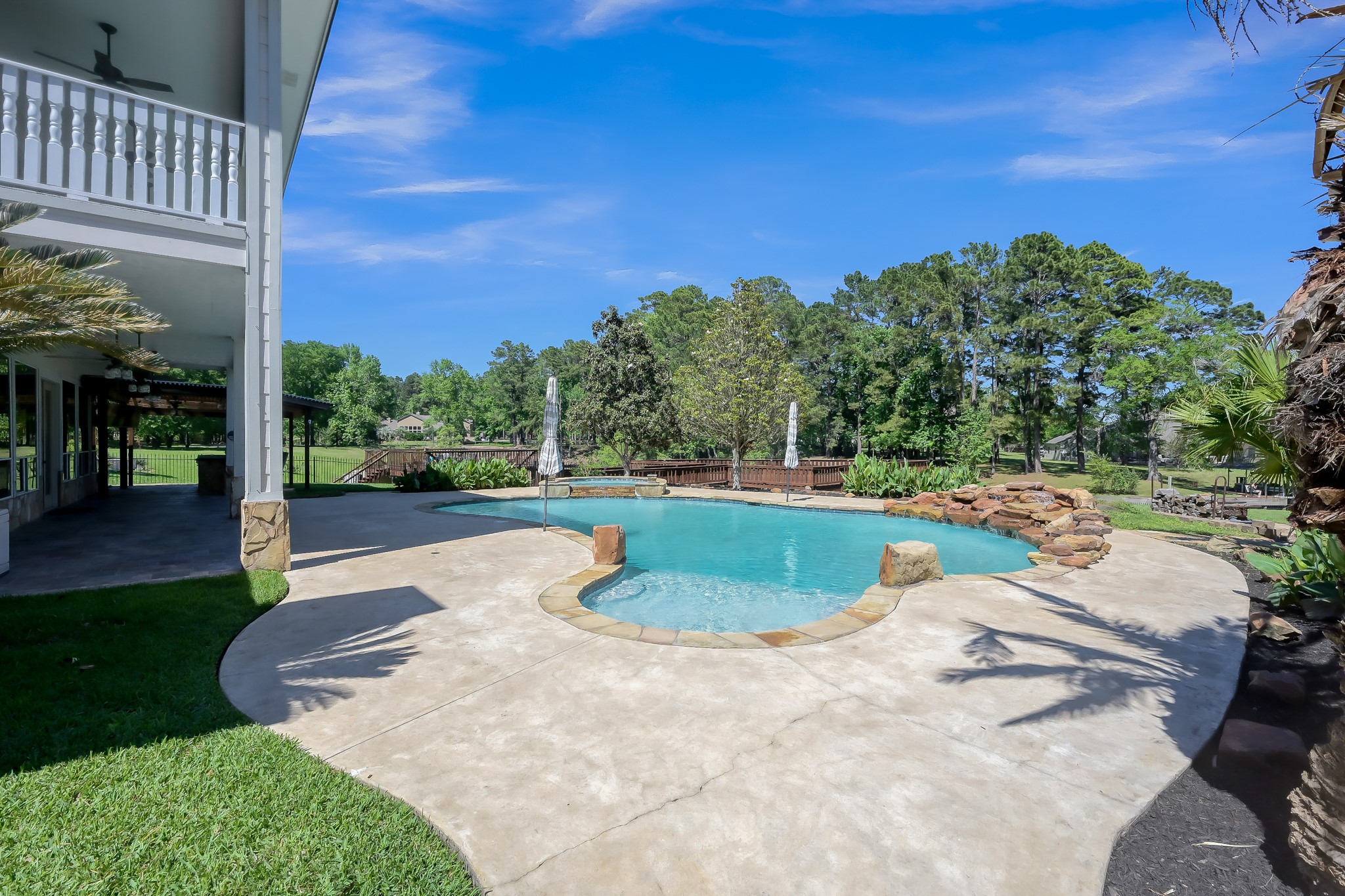12758 Aries Loop Willis, TX 77318 - Photo 32 of 48 Pool has Hot Tub and Waterfall