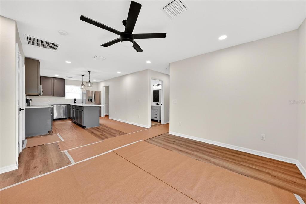 607 Thomas Avenue Leesburg, FL 34748 - Photo 13 of 50 a view of a kitchen with a sink and a ceiling fan