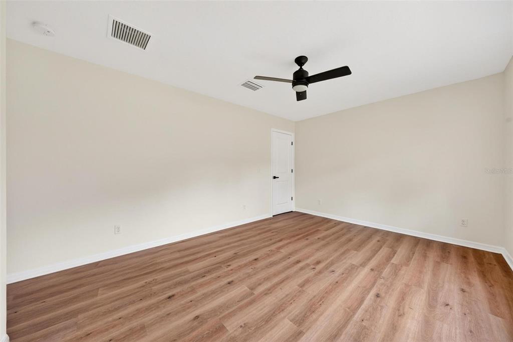 607 Thomas Avenue Leesburg, FL 34748 - Photo 21 of 50 wooden floor in an empty room