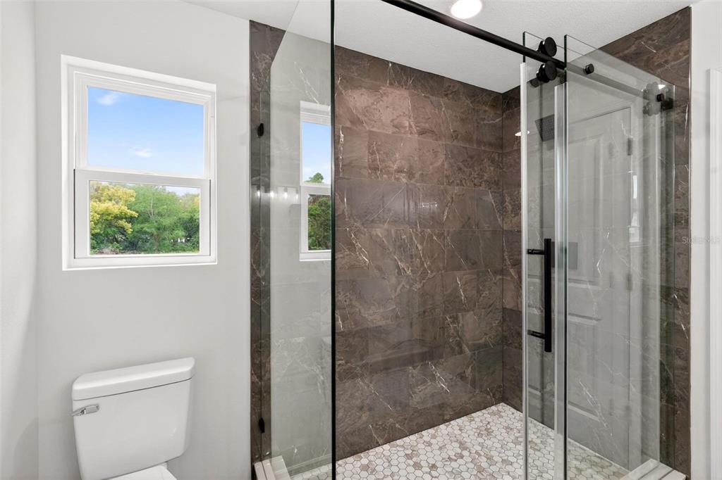 607 Thomas Avenue Leesburg, FL 34748 - Photo 29 of 50 a bathroom with a shower and toilet