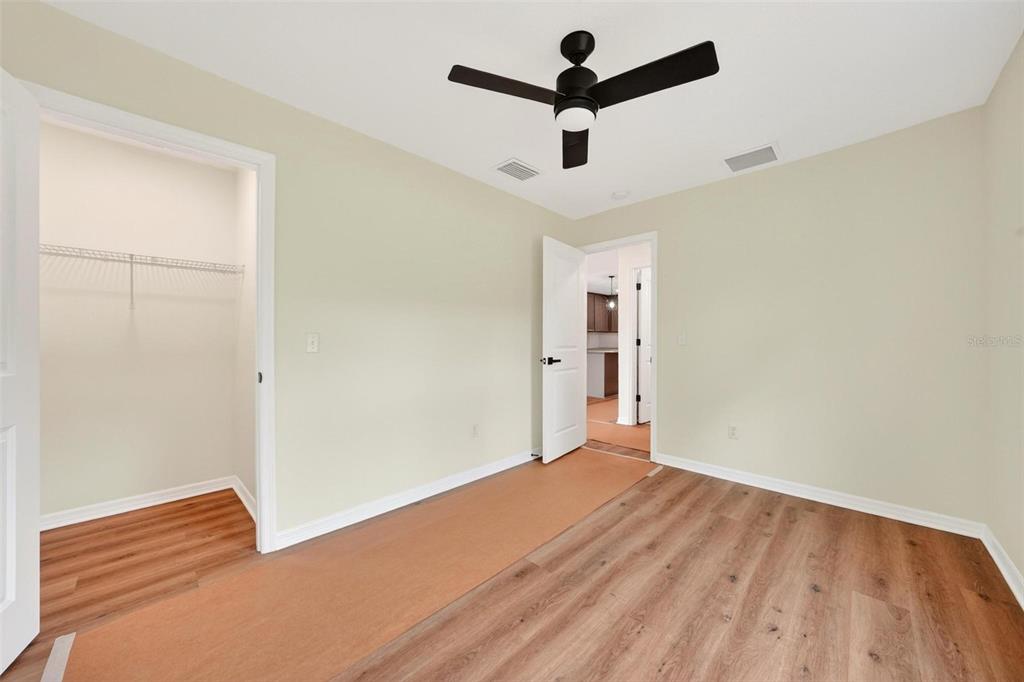 607 Thomas Avenue Leesburg, FL 34748 - Photo 35 of 50 an empty room with closet and a ceiling fan