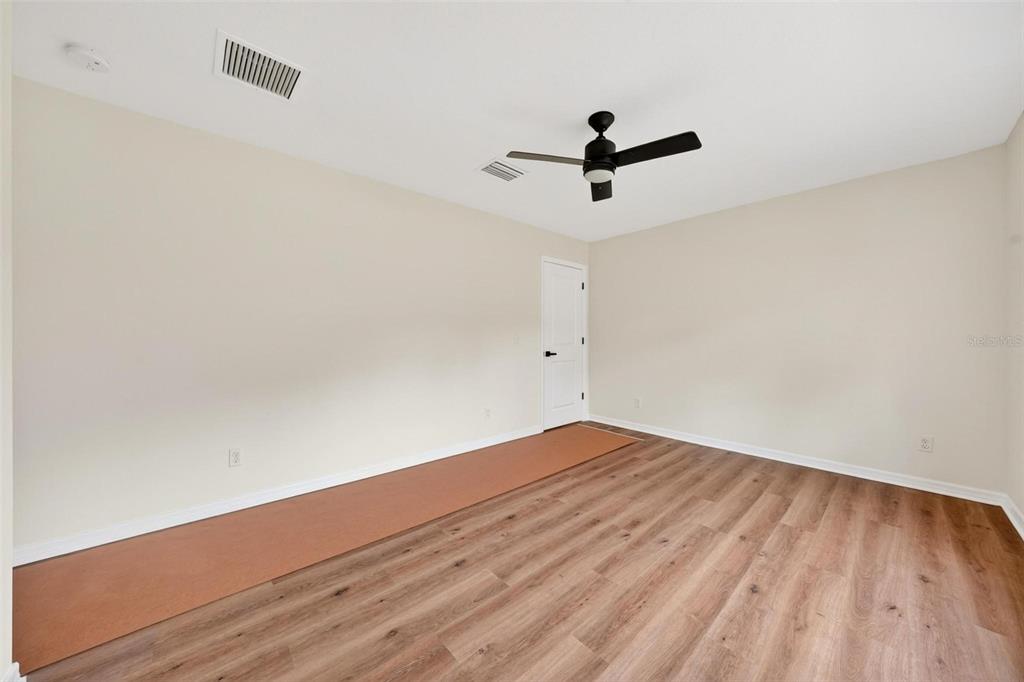 607 Thomas Avenue Leesburg, FL 34748 - Photo 40 of 50 wooden floor in an empty room
