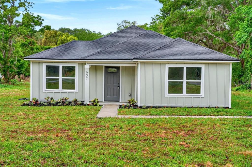 607 Thomas Avenue Leesburg, FL 34748 - Photo 43 of 50 a front view of a house with a yard