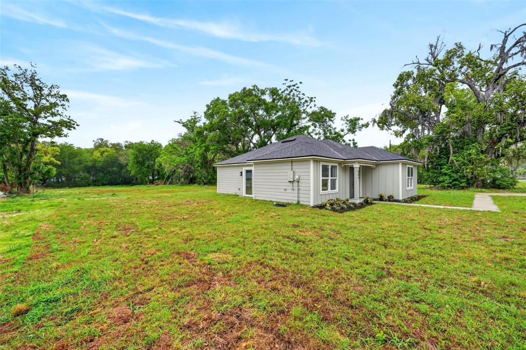 607 Thomas Avenue Leesburg, FL 34748 - Photo 46 of 50 a view of a house with a yard and tree