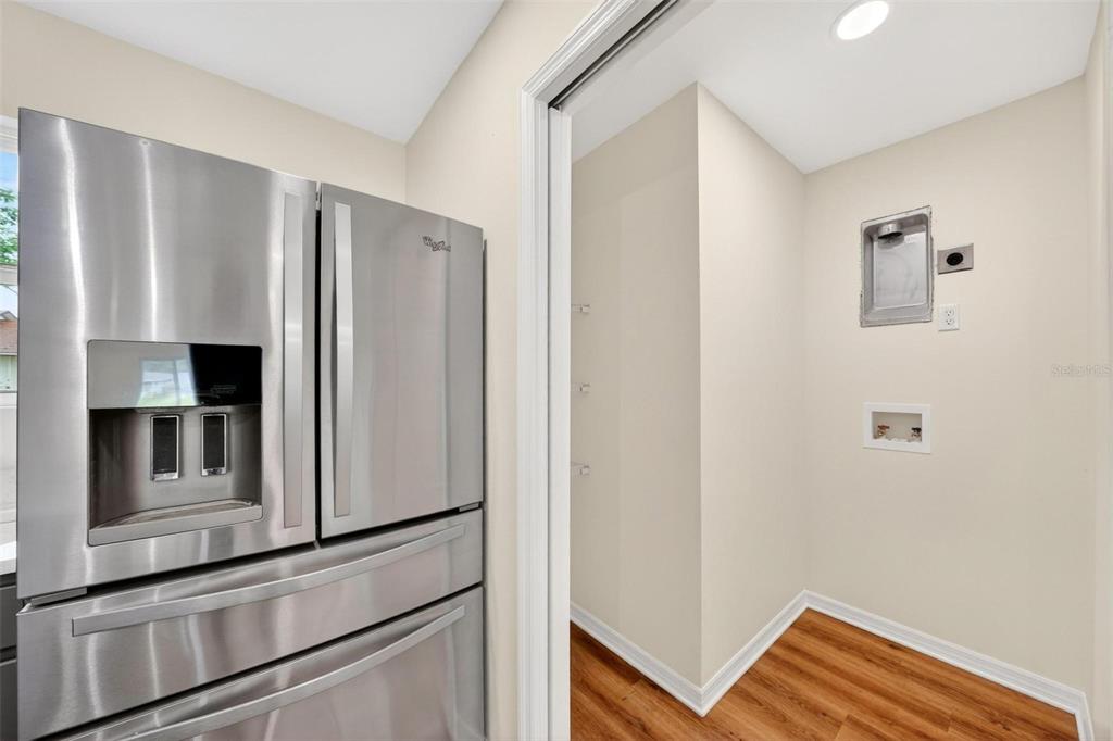 607 Thomas Avenue Leesburg, FL 34748 - Photo 6 of 50 a view of kitchen with stainless steel appliances refrigerator and microwave