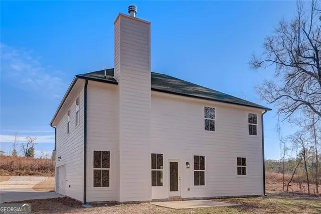a front view of a house with stairs