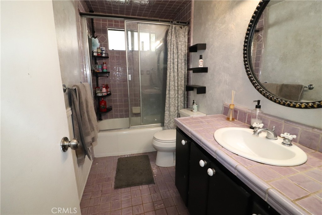 4040 Lehman Road La Crescenta, CA 91214 - Photo 7 of 10 a bathroom with a granite countertop sink a toilet and shower