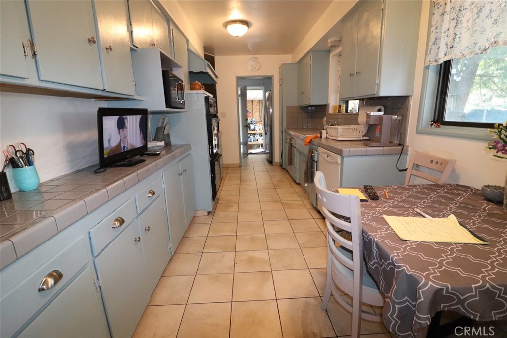 4040 Lehman Road La Crescenta, CA 91214 - Photo 9 of 10 a kitchen with stainless steel appliances granite countertop a stove a sink and a microwave