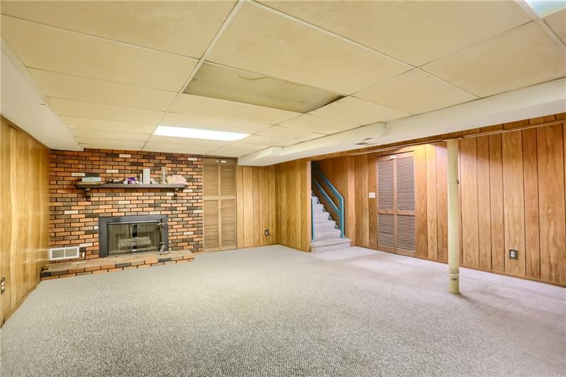 9558 Meadow Road Allison Park, PA 15101 - Photo 21 of 22 Large Gameroom with fireplace and storage