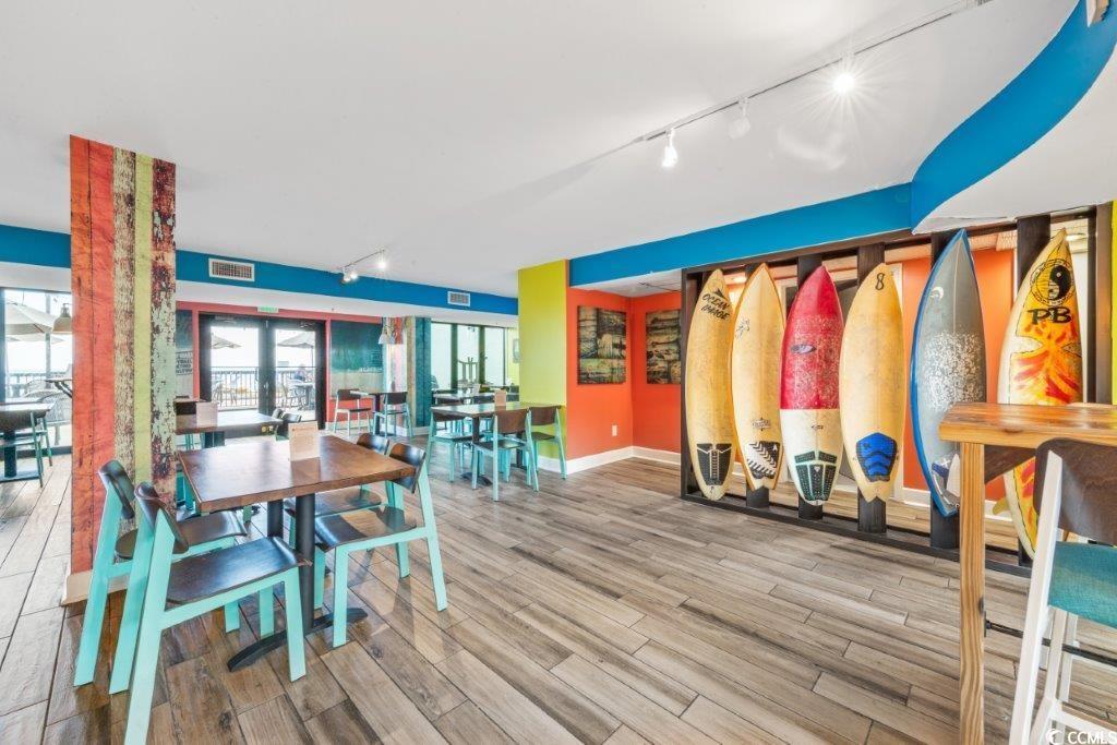 2311 South Ocean Boulevard, Unit 624 Myrtle Beach, SC 29577 - Photo 15 of 28 Dining area with rail lighting, wood finished floors, and french doors