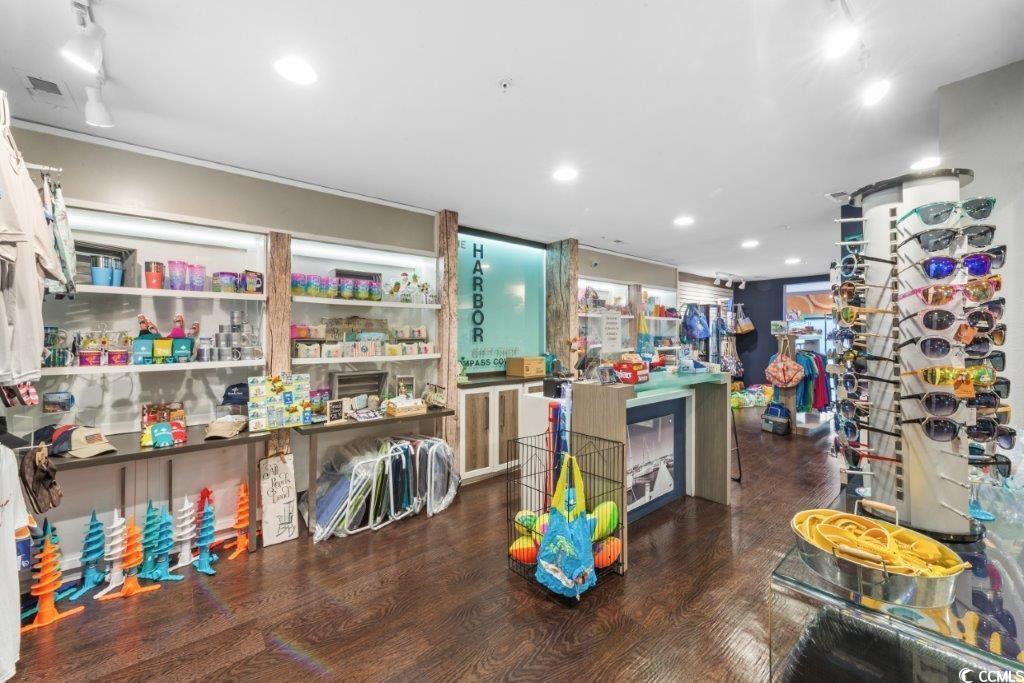 2311 South Ocean Boulevard, Unit 624 Myrtle Beach, SC 29577 - Photo 18 of 28 Miscellaneous items, including local jewelry, wine glasses, and beach bags, beach toys.