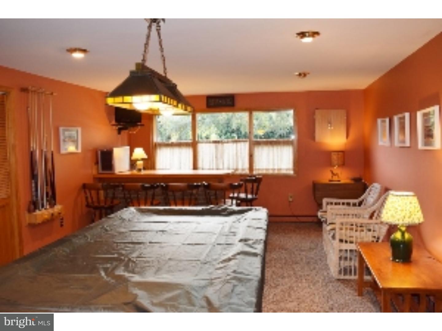 1707 Golf Road Reading, PA 19601 - Photo 13 of 17 a living room with furniture and a flat screen tv