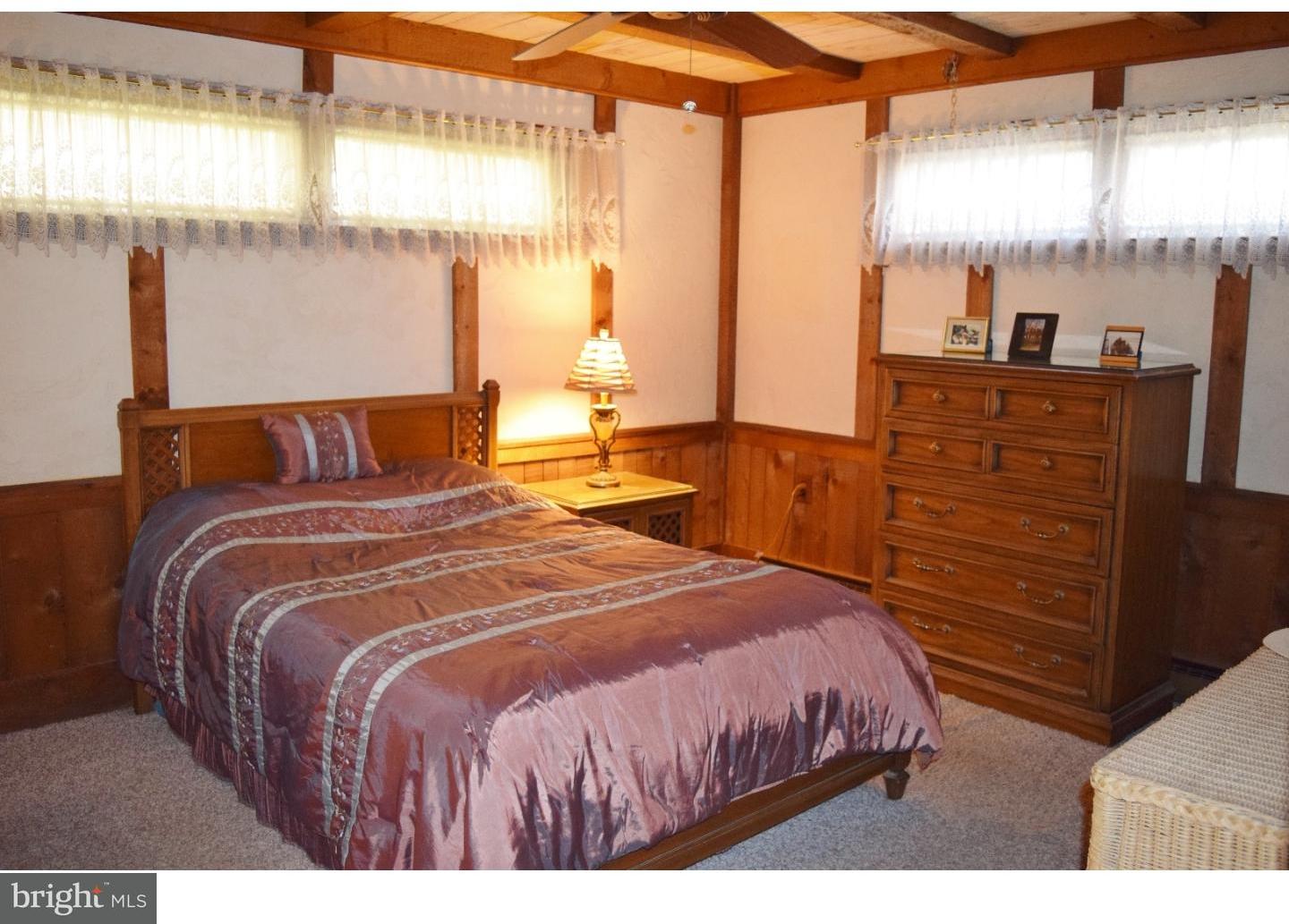 1707 Golf Road Reading, PA 19601 - Photo 14 of 17 a bedroom with a bed and wooden floor