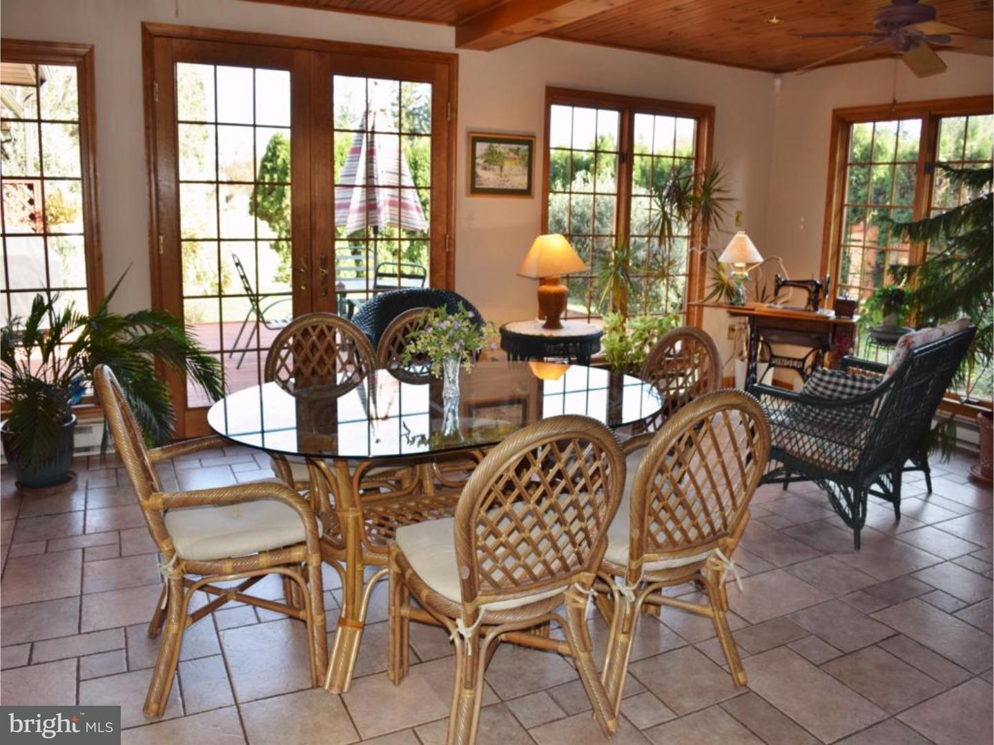 1707 Golf Road Reading, PA 19601 - Photo 6 of 17 a view of a dining room and livingroom with furniture wooden floor and a chandelier