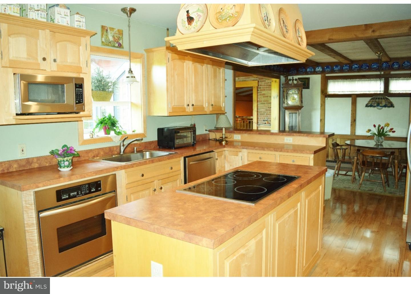 1707 Golf Road Reading, PA 19601 - Photo 9 of 17 a kitchen that has a stove and a microwave
