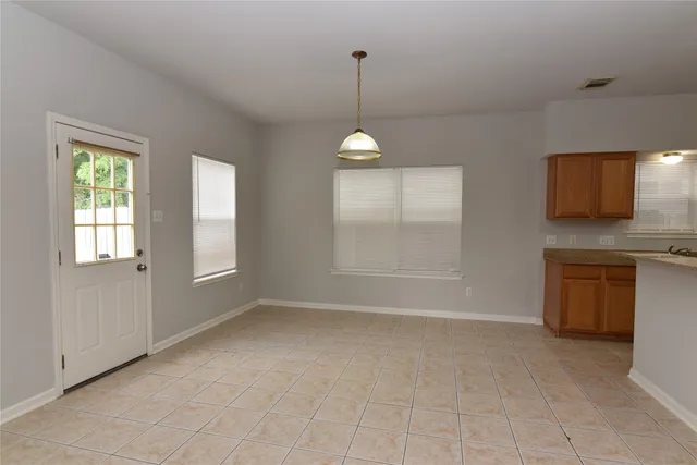a view of a room with a windows and a chandelier