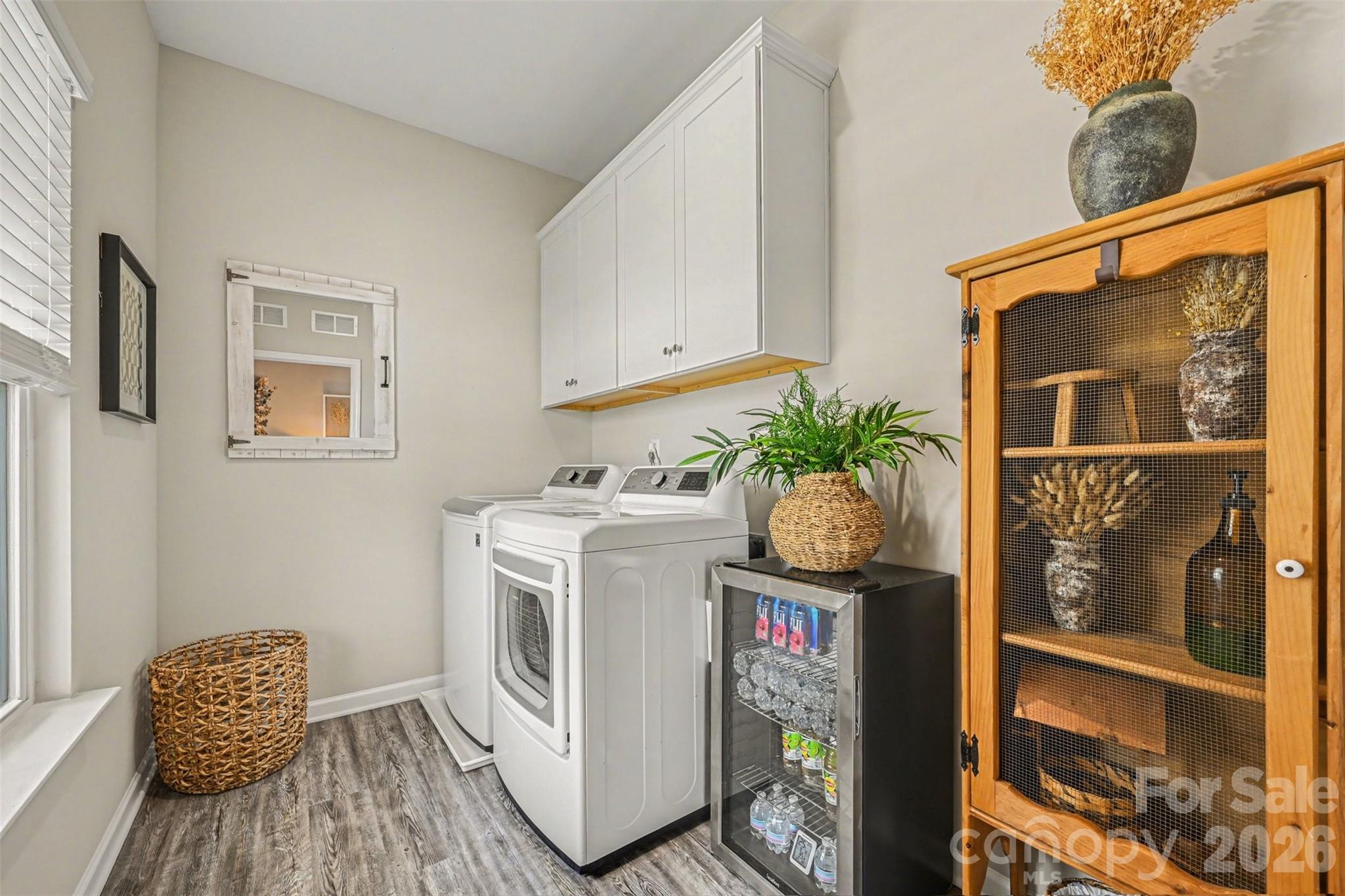 425 Kiser Lane Locust, NC 28097 - Photo 16 of 25 a utility room with fridge and wooden floor