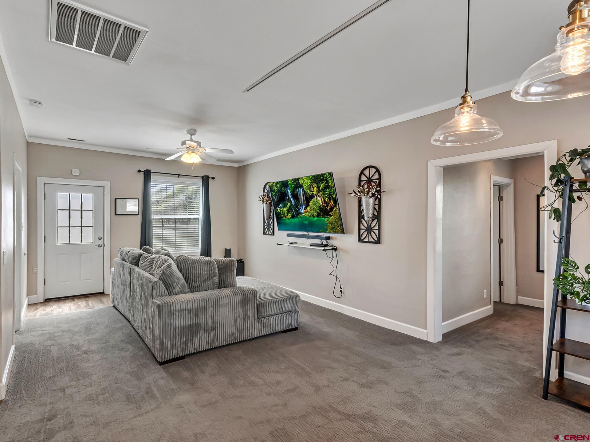 727 1550th Road Delta, CO 81416 - Photo 21 of 43 a living room with furniture and a flat screen tv
