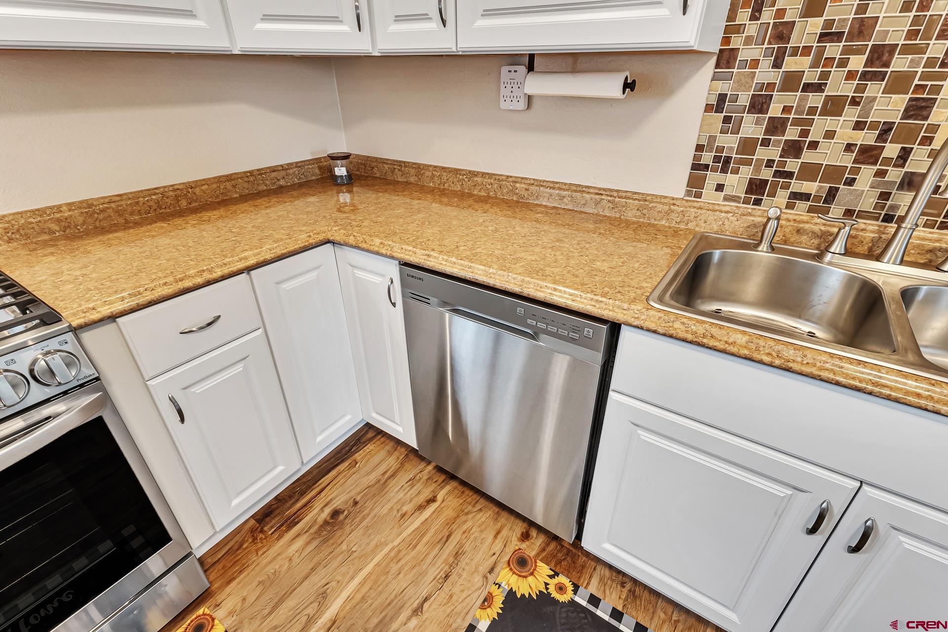 727 1550th Road Delta, CO 81416 - Photo 26 of 43 a view of a storage and utility room with washer and dryer
