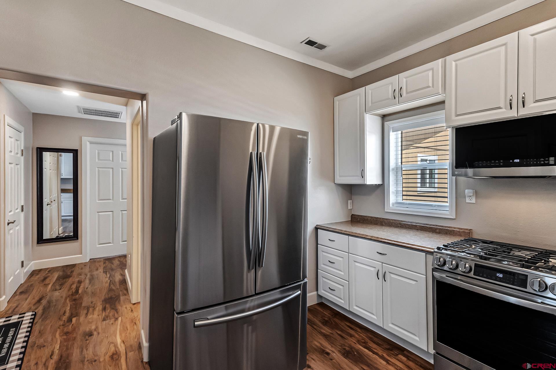 727 1550th Road Delta, CO 81416 - Photo 28 of 43 a kitchen with stainless steel appliances granite countertop a refrigerator stove and sink